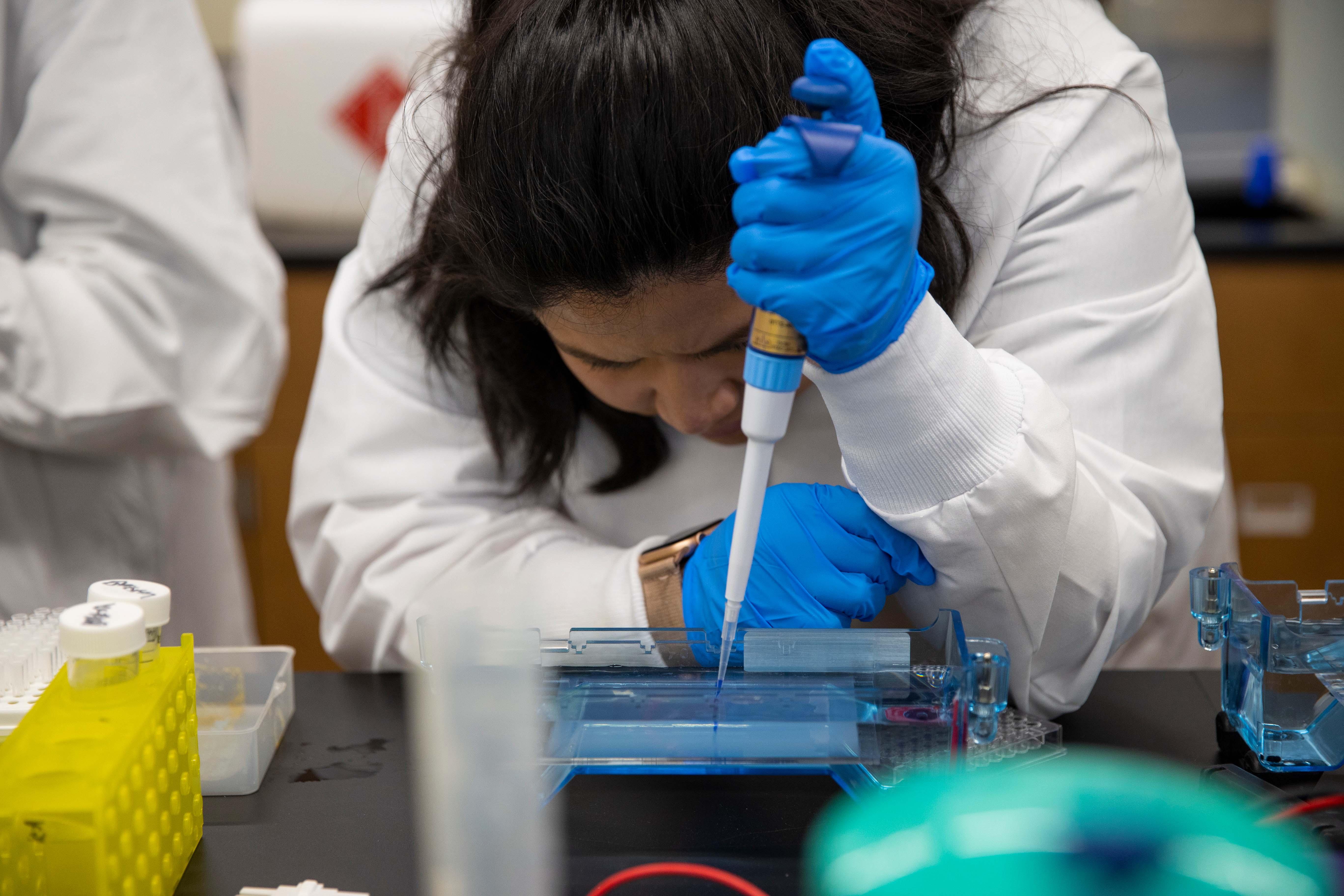 Partially staged and partially candid photographs of biology classes and student research. Wednesday, March 8, 2023.